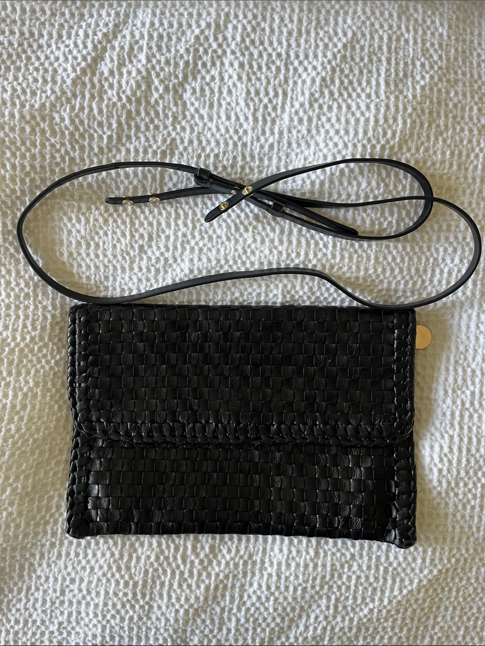 Clare v. Woven clutch